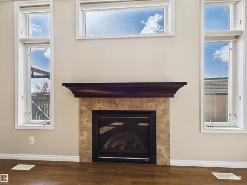 91 Copperhead Place, Stony Plain, AB - Indoor Photo Showing Living Room With Fireplace