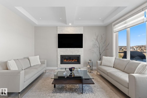 7640 179 Avenue, Edmonton, AB - Indoor Photo Showing Living Room With Fireplace