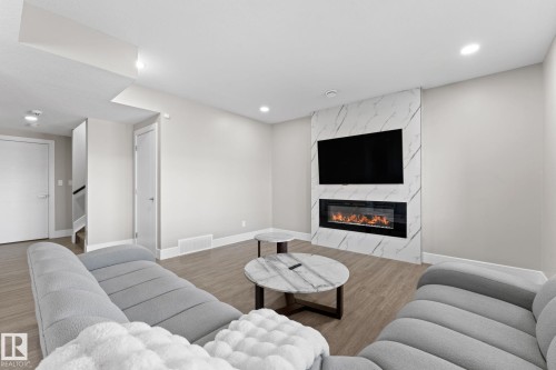 7640 179 Avenue, Edmonton, AB - Indoor Photo Showing Living Room With Fireplace