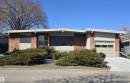 Mid-century modern residence featuring a brick facade, beige stucco accents, and a low-sloping roofline - 9624 75 Street, Edmonton, AB  - Outdoor 
