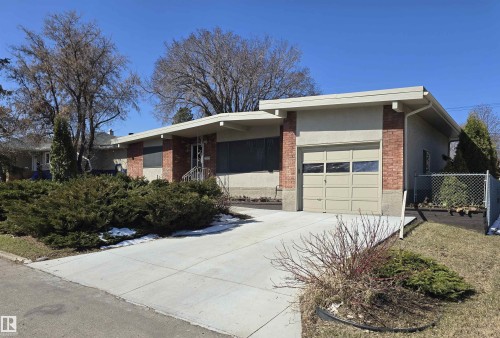 Ranch-style exterior featuring brick accents and a neutral stucco finish - 9624 75 Street, Edmonton, AB - Outdoor