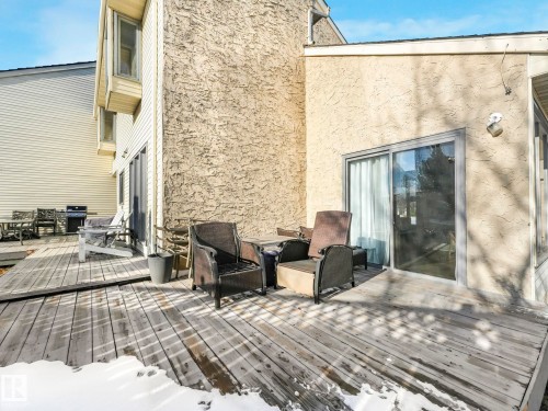 Expansive outdoor deck area with direct access to the interior via a sliding glass door - 12219 25 Avenue, Edmonton, AB - Outdoor With Deck Patio Veranda With Exterior