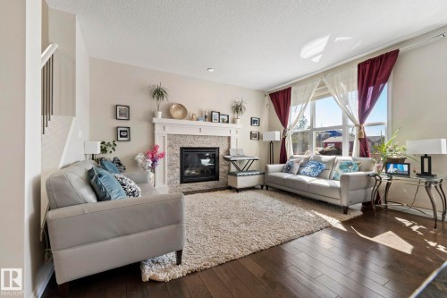 425 Simpkins Wynd, Leduc, AB - Indoor Photo Showing Living Room With Fireplace