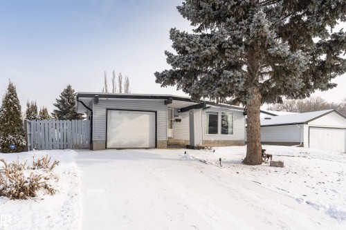 The property features a single-car garage and a paved driveway - 10412 39 Avenue, Edmonton, AB - Outdoor
