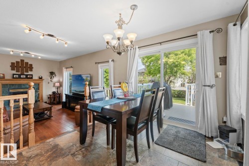 1802 2 Avenue, Cold Lake, AB - Indoor Photo Showing Dining Room With Fireplace