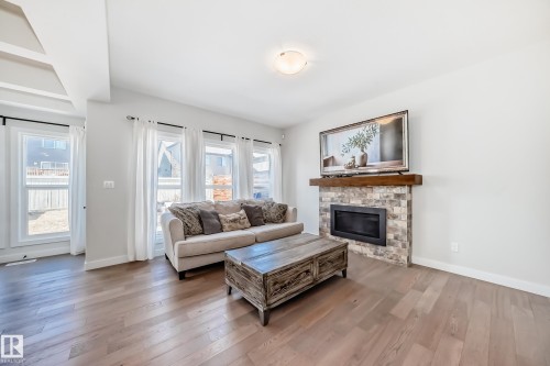 6479 Elston Loop, Edmonton, AB - Indoor Photo Showing Living Room With Fireplace