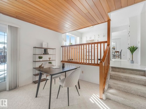 This space features a wooden slatted ceiling and light-colored carpeting - 3421 112A Street, Edmonton, AB - Indoor