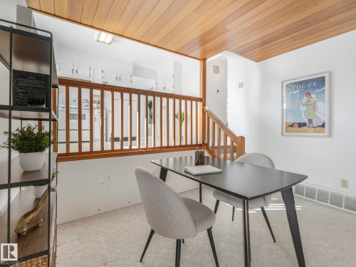 The interior features a wood paneled ceiling, carpeted flooring, and white walls - 3421 112A Street, Edmonton, AB - Indoor