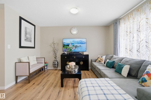 Living area featuring light wood flooring and light-colored walls - 13905 138 St, Edmonton, AB - Indoor Photo Showing Living Room
