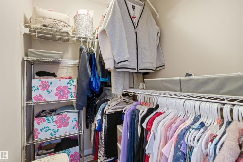 The property includes a closet with wire shelving and hanging rods for storage - 13905 138 St, Edmonton, AB - Indoor With Storage