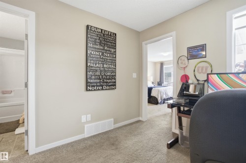This interior space features light-colored walls and carpeted flooring - 13905 138 St, Edmonton, AB - Indoor
