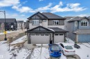 Modern two-story home featuring a combination of light gray siding and dark gray shingles - 3702 Claxton Place, Edmonton, AB  - Outdoor With Facade 
