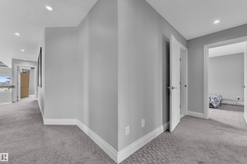 Corridor featuring neutral wall tones and recessed lighting - 3702 Claxton Place, Edmonton, AB - Indoor Photo Showing Other Room