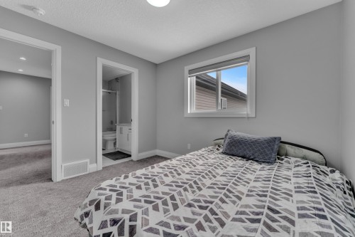 Carpeted room featuring a white-framed window, recessed lighting, and a white ceiling - 3702 Claxton Place, Edmonton, AB - Indoor Photo Showing Bedroom