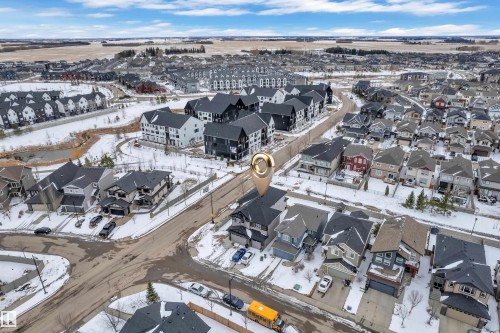 Aerial perspective showcasing a residential neighborhood with diverse housing styles - 3702 Claxton Place, Edmonton, AB - Outdoor With View