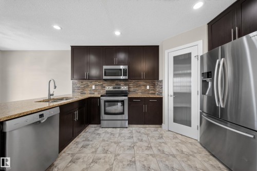 16717 60 Street, Edmonton, AB - Indoor Photo Showing Kitchen With Stainless Steel Kitchen With Double Sink With Upgraded Kitchen