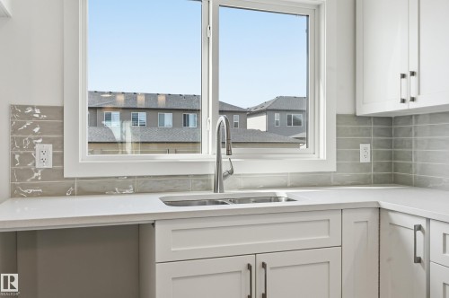 205 Wattle Road, Leduc, AB - Indoor Photo Showing Kitchen With Double Sink