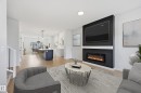 241 Wattle Road, Leduc, AB  - Indoor Photo Showing Living Room With Fireplace 