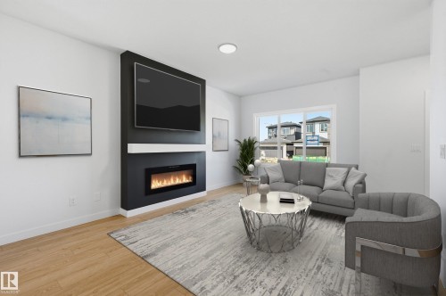 241 Wattle Road, Leduc, AB - Indoor Photo Showing Living Room With Fireplace