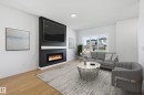 241 Wattle Road, Leduc, AB  - Indoor Photo Showing Living Room With Fireplace 