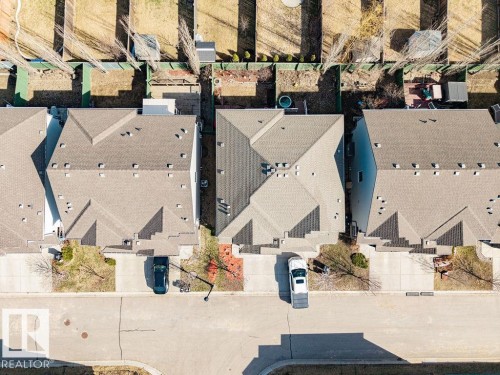 Asphalt shingle roof with multiple gables - 14 9350 211 Street, Edmonton, AB - 