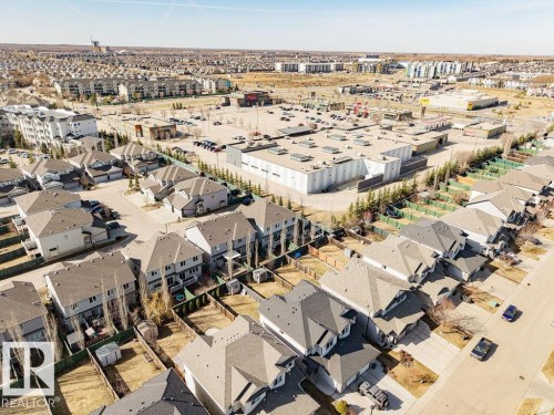 Residential neighborhood featuring detached homes and townhouses - 14 9350 211 Street, Edmonton, AB - Outdoor With View