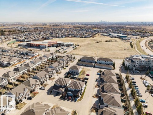 Aerial perspective showcasing a residential development with varied housing types - 14 9350 211 Street, Edmonton, AB - Outdoor With View