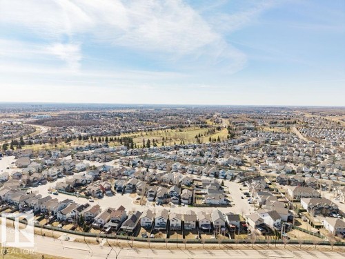 Expansive aerial perspective showcasing a residential development with numerous detached homes - 14 9350 211 Street, Edmonton, AB - Outdoor With View