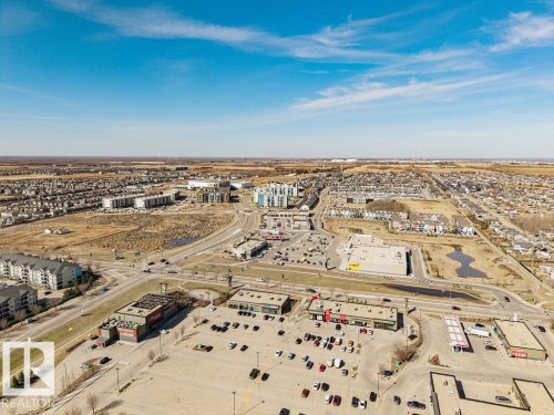 Aerial overview showcasing a developed commercial and residential area - 14 9350 211 Street, Edmonton, AB - Outdoor With View