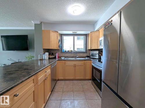 324 13111 140 Avenue, Edmonton, AB - Indoor Photo Showing Kitchen With Double Sink