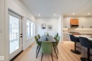 Open-concept dining area with wood-finish flooring, recessed lighting, and a full-light patio door - 16 Blackbird Bend, Fort Saskatchewan, AB  - Indoor 