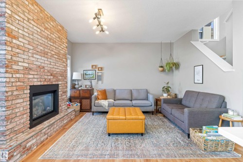 8355 Ellis Crescent, Edmonton, AB - Indoor Photo Showing Living Room With Fireplace
