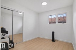 Room featuring light wood-finish flooring and white baseboards - 