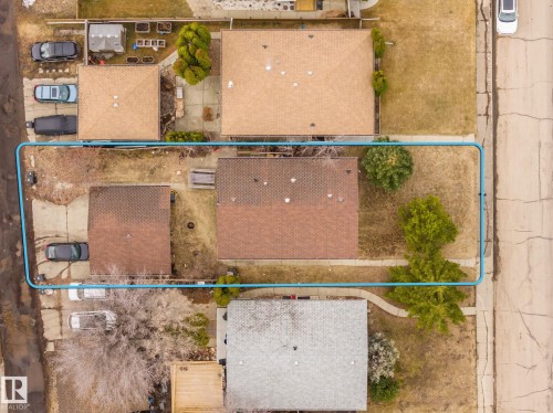 Overhead perspective showcasing a residential property featuring a main structure and a detached secondary structure, both with shingle roofing - 1566 Lakewood Road Nw, Edmonton, AB - 