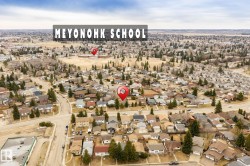 Aerial neighborhood perspective showcasing residential properties and community infrastructure - 