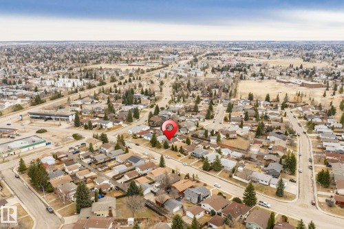 Aerial perspective showcasing a residential neighborhood with established homes and mature trees - 1566 Lakewood Road Nw, Edmonton, AB - Outdoor With View