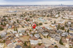 Aerial overview of a residential neighborhood with mixed architectural styles - 