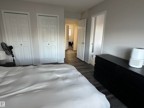 Interior space featuring neutral wall paint, wood-finish flooring, and white trim - 97 2021 Grantham Crest, Edmonton, AB - Indoor Photo Showing Bedroom