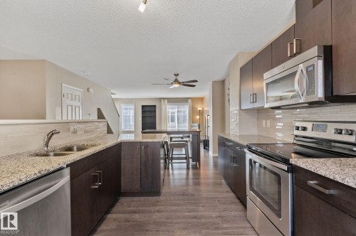 55 1030 Chappelle Boulevard, Edmonton, AB - Indoor Photo Showing Kitchen With Stainless Steel Kitchen With Double Sink With Upgraded Kitchen