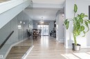 The interior features light-toned flooring and light gray walls, creating a bright and airy atmosphere - 35 675 Albany Way Nw, Edmonton, AB  - Indoor 