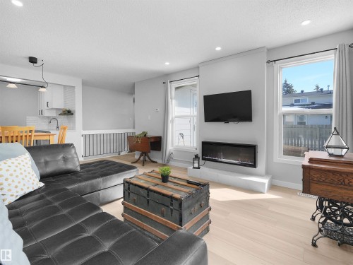 1164 Knottwood Road E, Edmonton, AB - Indoor Photo Showing Living Room With Fireplace