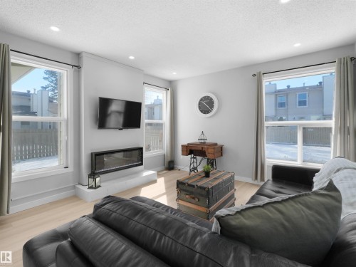 1164 Knottwood Road E, Edmonton, AB - Indoor Photo Showing Living Room With Fireplace