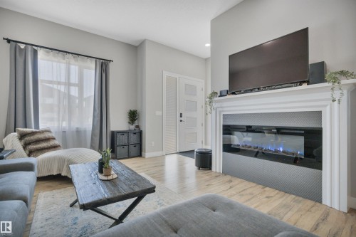 921 Berg Place, Leduc, AB - Indoor Photo Showing Living Room With Fireplace