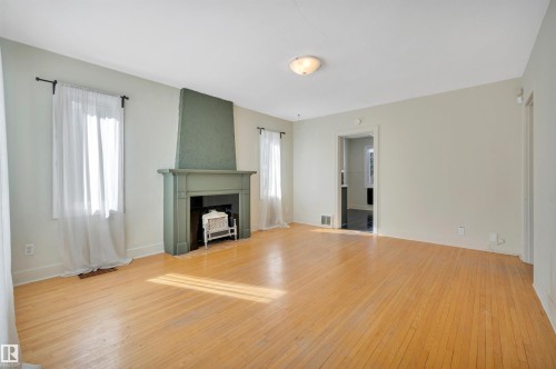 11608 91 Street, Edmonton, AB - Indoor Photo Showing Living Room With Fireplace