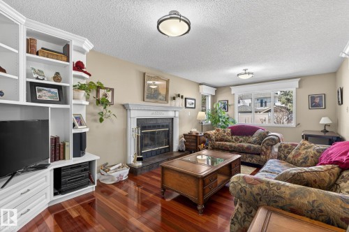 3108 36B Avenue, Edmonton, AB - Indoor Photo Showing Living Room With Fireplace