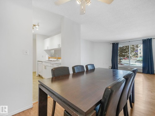 Open concept living space featuring wood-finish flooring - 143 10636 120 Street Nw, Edmonton, AB - Indoor Photo Showing Dining Room