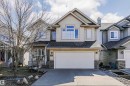 Contemporary two-story residence featuring light-toned siding and a prominent front-facing gable - 1915 126 Street, Edmonton, AB  - Outdoor With Facade 