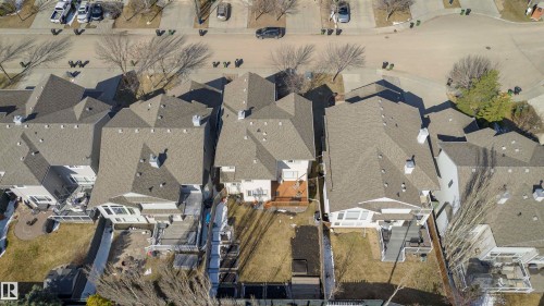 Aerial perspective of a residential street featuring multiple properties with pitched shingle roofs - 1915 126 Street, Edmonton, AB - Outdoor With View