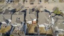 Aerial perspective of a residential street featuring multiple properties with pitched shingle roofs - 1915 126 Street, Edmonton, AB  - Outdoor With View 