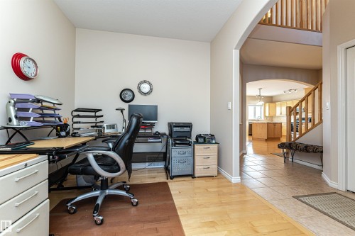 Versatile room featuring light wood-finish flooring and neutral wall tones - 1915 126 Street, Edmonton, AB - Indoor Photo Showing Office